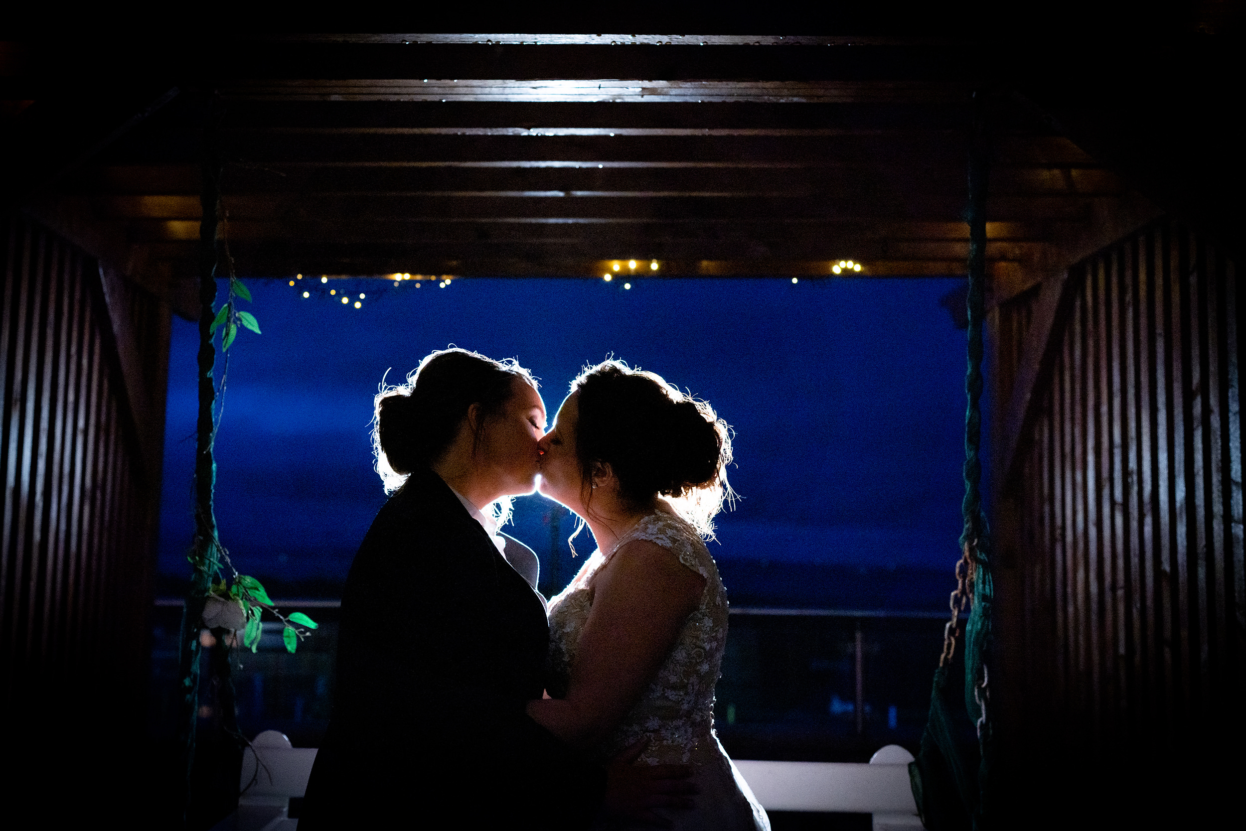 same sex kiss during wedding photography