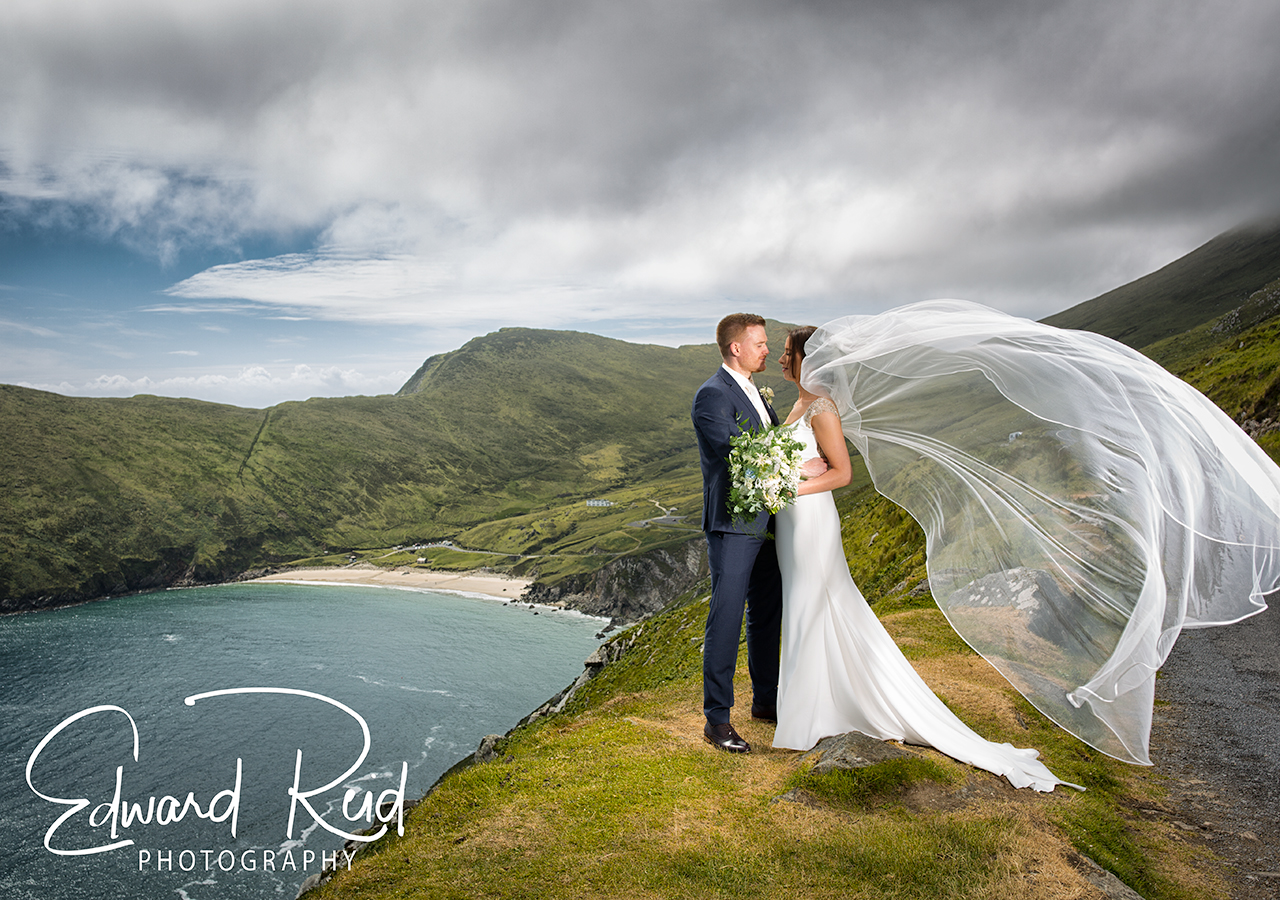 bride and groom overlooking keem beach on achill island