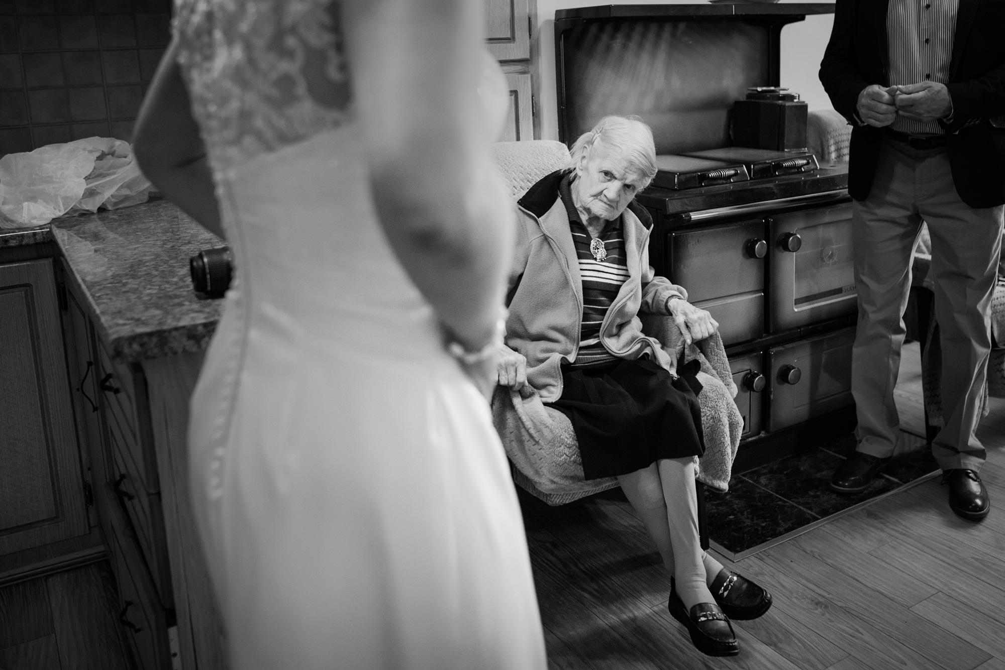 grandmother sees her granddaughter in her wedding dress for the first time