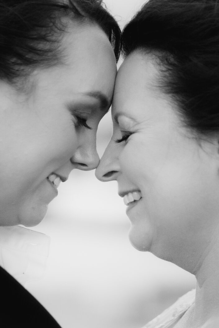 two ladies share a moment after their same sex wedding